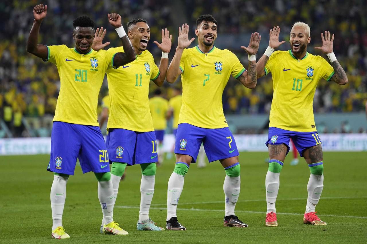 Brazil's Neymar, from right, celebrates with team mates Lucas Paqueta, Raphinha and Vinicius Junior...