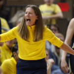 
              Michigan coach Kim Barnes Arico reacts to a call during the second half of an NCAA college basketball game against Ohio State in Columbus, Ohio, Saturday, Dec. 31, 2022. Ohio State won 66-57. (AP Photo/Paul Vernon)
            