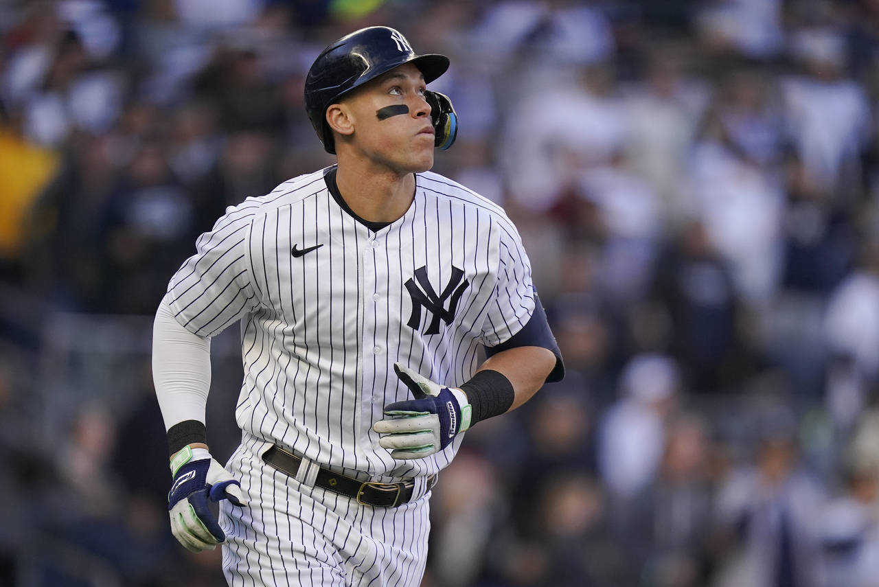 New York Yankees' Aaron Judge watches his solo home run ball during the second inning of Game 5 of ...