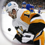 
              Pittsburgh Penguins' Bryan Rust (17) works to control the puck during the second period of an NHL hockey game against the Buffalo Sabres in Pittsburgh, Saturday, Dec. 10, 2022. (AP Photo/Gene J. Puskar)
            