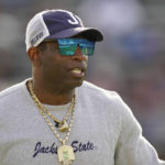 
              Jackson State head coach Deion Sanders surveys his players during warmups prior to the Southwestern Athletic Conference championship NCAA college football game against Southern University, Saturday, Dec. 3, 2022, in Jackson, Miss. Jackson State won 43-24. (AP Photo/Rogelio V. Solis)
            