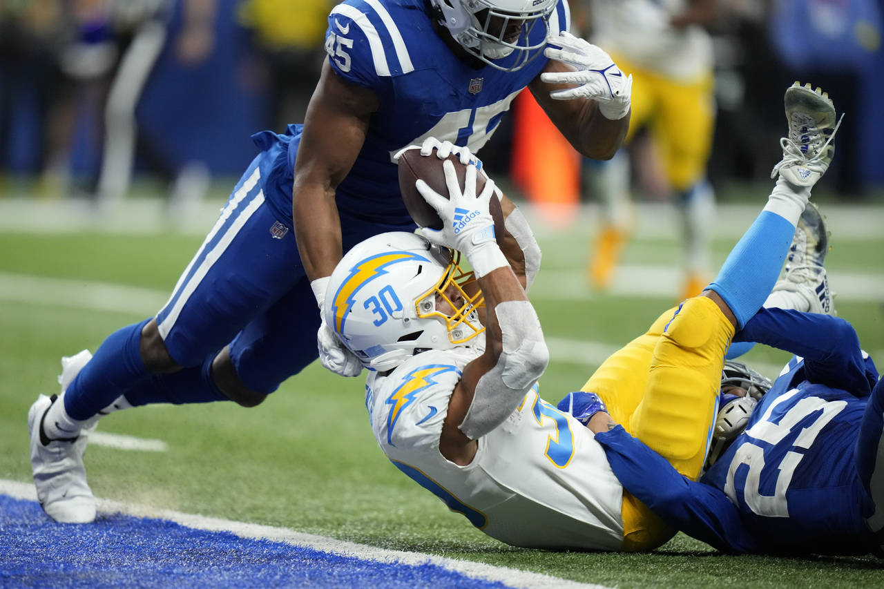 Los Angeles Chargers' Austin Ekeler (30) is tackled short of a touchdown by Indianapolis Colts' Rod...