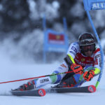 
              Slovenia's Zan Kranjec speeds down the course during an alpine ski, men's World Cup giant slalom, in Alta Badia, Italy, Sunday, Dec. 18, 2022. (AP Photo/Alessandro Trovati)
            