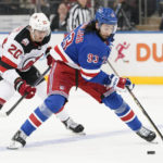 
              New York Rangers center Mika Zibanejad (93) controls the puck against New Jersey Devils center Michael McLeod (20) during the third period of an NHL hockey game, Monday, Dec. 12, 2022, at Madison Square Garden in New York. (AP Photo/Mary Altaffer)
            