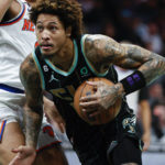 
              Charlotte Hornets guard Kelly Oubre Jr., right, drives past New York Knicks guard Quentin Grimes during the first half of an NBA basketball game in Charlotte, N.C., Friday, Dec. 9, 2022. (AP Photo/Nell Redmond)
            