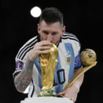 
              Argentina's Lionel Messi kisses the trophy after winning the World Cup final soccer match between Argentina and France at the Lusail Stadium in Lusail, Qatar, Sunday, Dec. 18, 2022. Argentina won 4-2 in a penalty shootout after the match ended tied 3-3. (AP Photo/Martin Meissner)
            