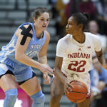 
              Indiana's Chloe Moore-McNeil (22) is defended by North Carolina's Eva Hodgson (10) during the first half of an NCAA college basketball game, Thursday, Dec. 1, 2022, in Bloomington, Ind. (AP Photo/Darron Cummings)
            
