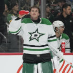
              Dallas Stars goaltender Jake Oettinger (29) hydrates during an ice-cleaning break during the first period of an NHL hockey game against the Minnesota Wild, Thursday, Dec. 29, 2022, in St. Paul, Minn. (AP Photo/Abbie Parr)
            