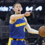 
              Golden State Warriors guard Donte DiVincenzo gestures to teammates while bringing the ball up during the first half of the team's NBA basketball game against the Utah Jazz in San Francisco, Wednesday, Dec. 28, 2022. (AP Photo/Jeff Chiu)
            