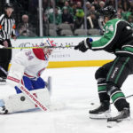 
              Montreal Canadiens goaltender Jake Allen (34) blocks as shot by Dallas Stars center Roope Hintz (24) in the first period of an NHL hockey game, Friday, Dec. 23, 2022, in Dallas. (AP Photo/Tony Gutierrez)
            