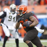 
              Cleveland Browns running back Nick Chubb (24) rushes during the second half of an NFL football game against the New Orleans Saints, Saturday, Dec. 24, 2022, in Cleveland. (AP Photo/Ron Schwane)
            