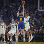 
              Golden State Warriors guard Klay Thompson (11) shoots a 3-point basket over Charlotte Hornets forward P.J. Washington during the first half of an NBA basketball game in San Francisco, Tuesday, Dec. 27, 2022. (AP Photo/Godofredo A. Vásquez)
            