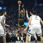 
              Golden State Warriors guard Jordan Poole (3) shoots a 3-point basket against the Memphis Grizzlies during the first half of an NBA basketball game in San Francisco, Sunday, Dec. 25, 2022. (AP Photo/Godofredo A. Vásquez)
            