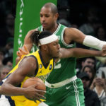 
              Indiana Pacers center Myles Turner pushes away Boston Celtics center Al Horford during the first half of an NBA basketball game Wednesday, Dec. 21, 2022, in Boston. (AP Photo/Charles Krupa)
            