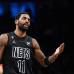 
              Brooklyn Nets guard Kyrie Irving (11) gestures during the first half of the team's NBA basketball game against the Toronto Raptors on Friday, Dec. 2, 2022, in New York. (AP Photo/Eduardo Munoz Alvarez)
            