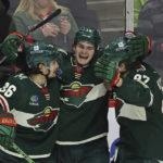 
              Minnesota Wild center Sam Steel (13) celebrates with right wing Mats Zuccarello (36) and left wing Kirill Kaprizov (97) after scoring goal against the Edmonton Oilers during the third period of an NHL hockey game Thursday, Dec. 1, 2022, in St. Paul, Minn. (AP Photo/Stacy Bengs)
            
