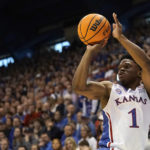 
              Kansas guard Joseph Yesufu puts up a shot during the first half of an NCAA college basketball game against Oklahoma State Saturday, Dec. 31, 2022, in Lawrence, Kan. (AP Photo/Charlie Riedel)
            