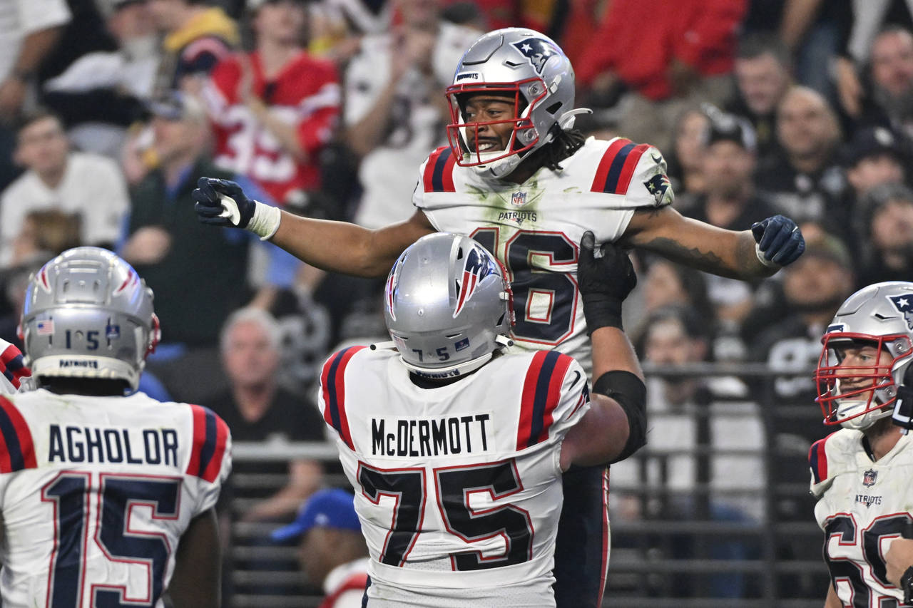New England Patriots wide receiver Jakobi Meyers (16) is congratulated after a two-point conversion...
