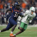 
              UTSA  running back Kevorian Barnes (31) runs for a touchdown past North Texas defensive back Logan Wilson (13) during the first half of an NCAA college football game for the Conference USA championship in San Antonio, Friday, Dec. 2, 2022. (AP Photo/Eric Gay)
            