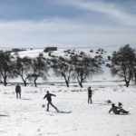 
              Children play football in the snow in Tighanmin, a Middle Atlas village near Azilal, central Morocco, Thursday Feb. 15, 2018. (AP Photo/Mosa'ab Elshamy)
            