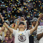
              FILE - South Carolina head coach Dawn Staley celebrates after a college basketball game in the final round of the Women's Final Four NCAA tournament against UConn, April 3, 2022, in Minneapolis. South Carolina won 64-49 to win the championship. (AP Photo/Eric Gay, File)
            