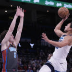 
              Minnesota Timberwolves guard Bryn Forbes, right, shoots as Oklahoma City Thunder guard Josh Giddey (3) defends in the second half of an NBA basketball game Friday, Dec. 16, 2022, in Oklahoma City. (AP Photo/Sue Ogrocki)
            