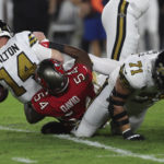 
              Tampa Bay Buccaneers linebacker Lavonte David (54) brings down New Orleans Saints quarterback Andy Dalton (14) in the first half of an NFL football game in Tampa, Fla., Monday, Dec. 5, 2022. (AP Photo/Mark LoMoglio)
            