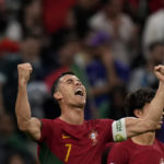 
              Portugal's Cristiano Ronaldo celebrates after scoring his side's opening goal during the World Cup group H soccer match between Portugal and Uruguay, at the Lusail Stadium in Lusail, Qatar, Monday, Nov. 28, 2022. (AP Photo/Aijaz Rahi)
            