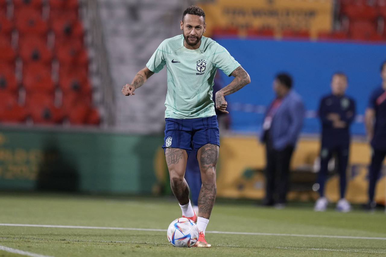 Brazil's Neymar practices during a training session at the Grand Hamad stadium in Doha, Qatar, Sund...