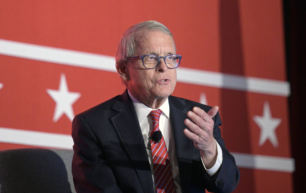 FILE - Ohio Gov. Mike DeWine answers a question while taking part in a panel discussion during a Re...