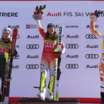 
              Switzerland's Wendy Holdener, center, winner of an alpine ski, women's World Cup slalom, celebrates on the podium with second-placed United States' Mikaela Shiffrin, left, and third-placed Slovakia's Petra Vlhova, in Sestriere, Italy, Sunday, Dec.11, 2022. (AP Photo/Alessandro Trovati)
            