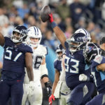 
              Tennessee Titans defensive tackle Teair Tart (93) reacts to a fumble recovery against the Dallas Cowboys during the first half of an NFL football game, Thursday, Dec. 29, 2022, in Nashville, Tenn. (AP Photo/Chris Carlson)
            