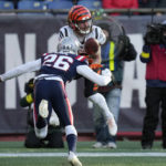 
              Cincinnati Bengals wide receiver Trenton Irwin, top, makes a catch in the end zone for a touchdown as New England Patriots cornerback Shaun Wade (26) tries to defend during the first half of an NFL football game, Saturday, Dec. 24, 2022, in Foxborough, Mass. (AP Photo/Charles Krupa)
            
