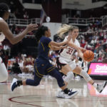
              Stanford guard Hannah Jump (33) passes the ball while defended by California guard Leilani McIntosh during the first half of an NCAA college basketball game in Stanford, Calif., Friday, Dec. 23, 2022. (AP Photo/Godofredo A. Vásquez)
            