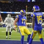 
              Los Angeles Rams quarterback Baker Mayfield (17) celebrates with teammates wide receiver Tutu Atwell (15) and center Brian Allen (55) after a touchdown by wide receiver Van Jefferson, right, during the second half of an NFL football game against the Las Vegas Raiders, Thursday, Dec. 8, 2022, in Inglewood, Calif. (AP Photo/Marcio Jose Sanchez)
            