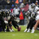 
              The Baltimore Ravens and the Atlanta Falcons line up on the line of scrimmage during the second half of an NFL football game, Saturday, Dec. 24, 2022, in Baltimore. (AP Photo/Julio Cortez)
            