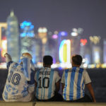 
              Fans of Argentina sit on Doha corniche, in Doha, Qatar, Monday, Dec. 12, 2022. Argentina will face Croatia in a World Cup semifinal soccer match on Dec. 13. (AP Photo/Andre Penner)
            