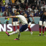 
              England's Harry Kane scores his side's opening goal during the World Cup quarterfinal soccer match between England and France, at the Al Bayt Stadium in Al Khor, Qatar, Saturday, Dec. 10, 2022. (AP Photo/Frank Augstein)
            