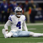 
              Dallas Cowboys quarterback Dak Prescott (4) sits on the turf after an incomplete pass in the first half an NFL football game against the Houston Texans, Sunday, Dec. 11, 2022, in Arlington, Texas. (AP Photo/Ron Jenkins)
            