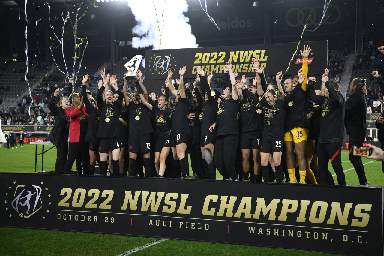 FILE - Portland Thorns FC celebrates with the trophy after the won the NWSL championship soccer mat...