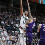 
              Michigan State's A.J. Hoggard, left, shoots against Northwestern's Boo Buie during the first half of an NCAA college basketball game, Sunday, Dec. 4, 2022, in East Lansing, Mich. (AP Photo/Al Goldis)
            