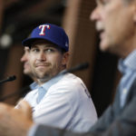 
              Texas Rangers starting pitcher Jacob deGrom, left, listens to new manger Bruce Bochy after trying on his new jersey during a press conference at Globe Life Field in Arlington, Texas, Thursday, Dec. 8, 2022. Jacob deGrom is the latest big signing for the Rangers in their effort to turn things around, with his $185 million, five-year deal getting completed last Friday even before baseball winter meetings.(Tom Fox/The Dallas Morning News via AP)
            