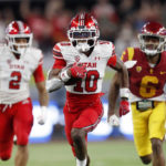 
              Utah wide receiver Money Parks (10) outruns Southern California defensive back Mekhi Blackmon (6) to score a touchdown during the second half of the Pac-12 Conference championship NCAA college football game Friday, Dec. 2, 2022, in Las Vegas. Utah running back Micah Bernard is at left. (AP Photo/Steve Marcus)
            