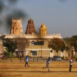 
              With the Karya Siddhi Hanuman Temple in the background, a cricket match between the Dallas Cricket Connections and the Kingswood Cricket Club is played on a field adjacent to Roach Middle School in Frisco, Texas, Saturday, Oct. 22, 2022. The teams play in the City of Frisco Cricket league. (AP Photo/Andy Jacobsohn)
            