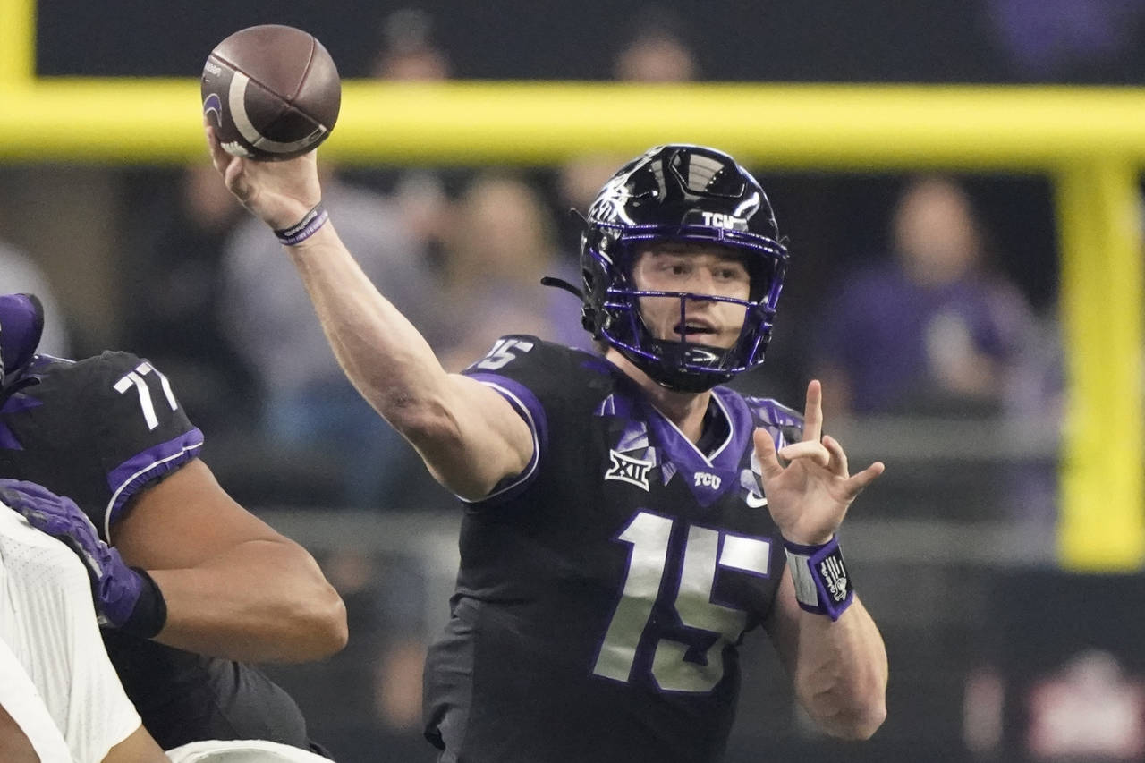 TCU quarterback Max Duggan (15) throws in the first half of the Big 12 Conference championship NCAA...