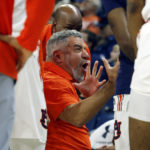 
              Auburn head coach Bruce Pearl talks with players in a timeout during the first half of an NCAA college basketball game against Georgia State Wednesday, Dec. 14, 2022, in Auburn, Ala. (AP Photo/Butch Dill)
            
