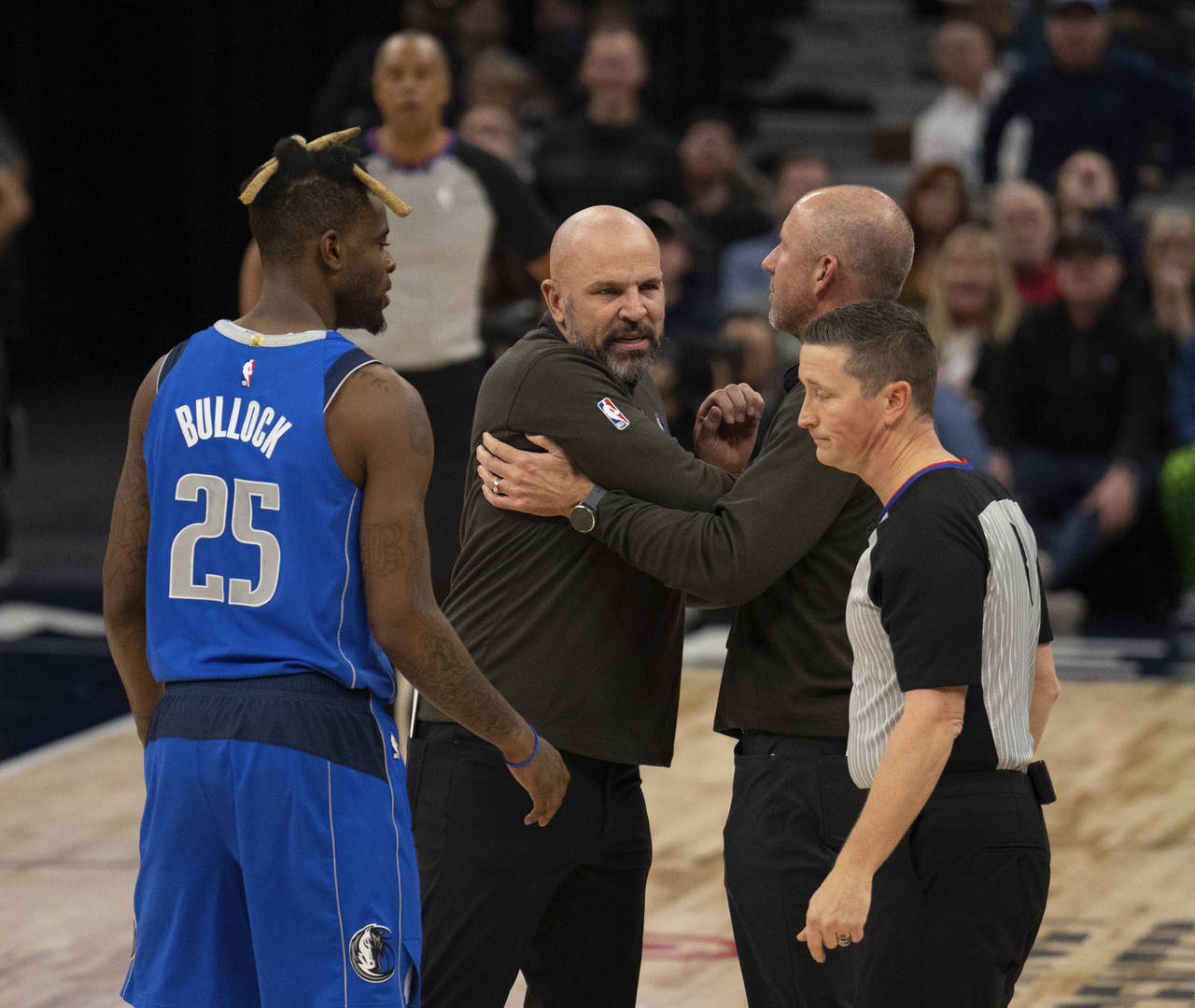 Dallas Mavericks head coach Jason Kidd, second from left, reacts after being ejected during the sec...