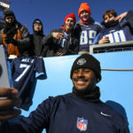 
              Tennessee Titans quarterback Malik Willis takes a photo with fans before an NFL football game between the Tennessee Titans and the Houston Texans, Saturday, Dec. 24, 2022, in Nashville, Tenn. (AP Photo/John Amis)
            