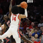 
              Ohio State's Justice Sueing, front, tries to shoot over Saint Francis' Wisler Sanon during the first half of an NCAA college basketball game on Saturday, Dec. 3, 2022, in Columbus, Ohio. (AP Photo/Jay LaPrete)
            