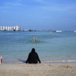 
              People sit and swim at Katara Beach, in Doha, Qatar, Thursday, Dec. 1, 2022. (AP Photo/Jorge Saenz)
            